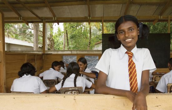 Girl in school in India receiving education and literacy