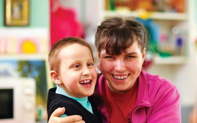 teacher with blind child in school for the blind